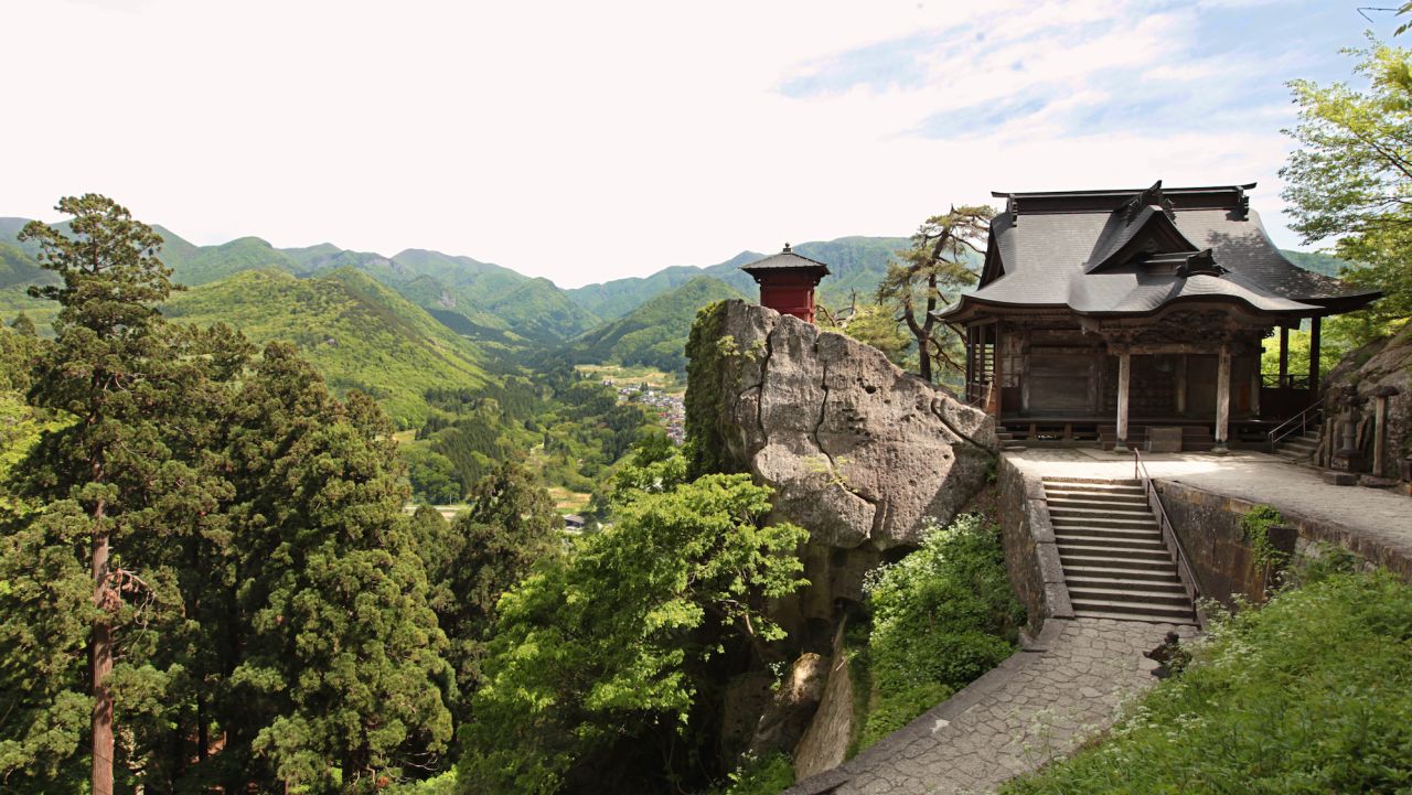 Perhaps the most photographed buildings at Yamadera: Kaisando Hall and the red Nokyodo building.