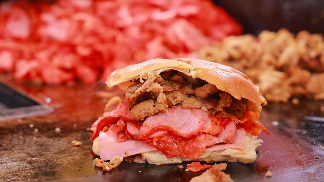 A traditional torta is prepared on a hot griddle during Mexico's 