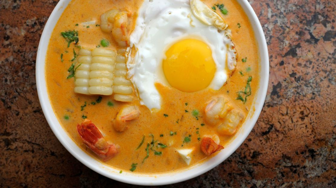 Chupe de Camarones, a creamy shrimp chowder with potatoes and corn, gets a kick from the addition of ají amarillo, a chili pepper.