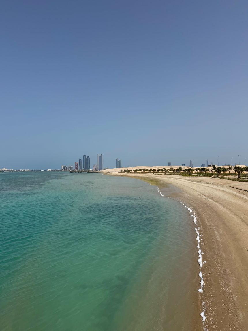 The beach on Hudayriyat Island, with Abu Dhabi's city skyline in the background.