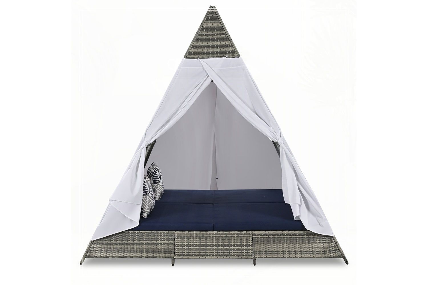 A triangular outdoor wicker patio tent with white drapes and a cushion inside